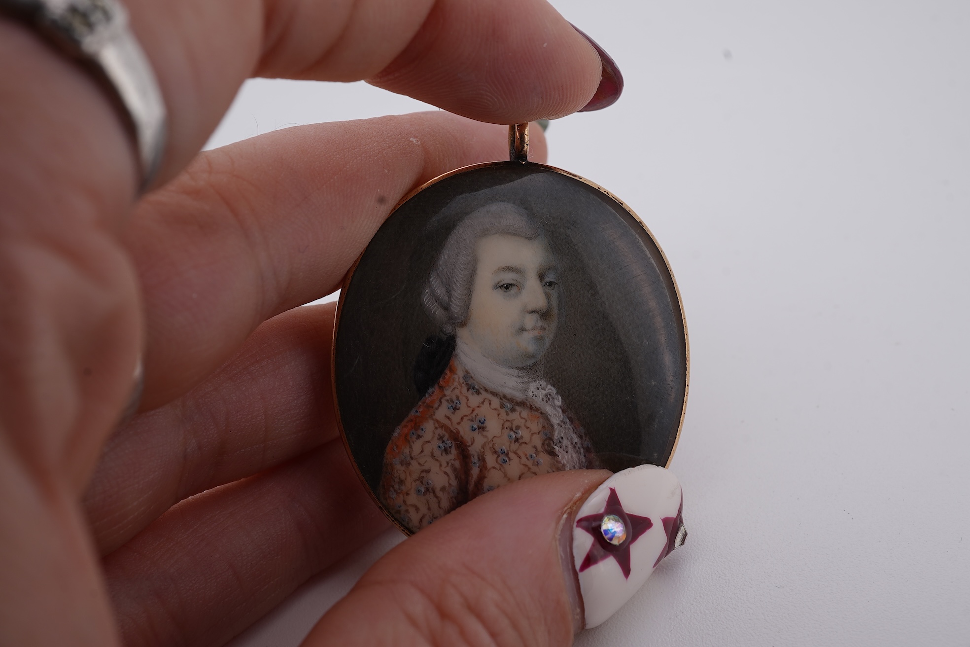 A 19th century gilt framed oval miniature watercolour portrait of a gentleman, on ivory, verso decorated with hair, depicting a landscape scene with a large tree, animals and a house, 36mm. CITES Submission reference, WU